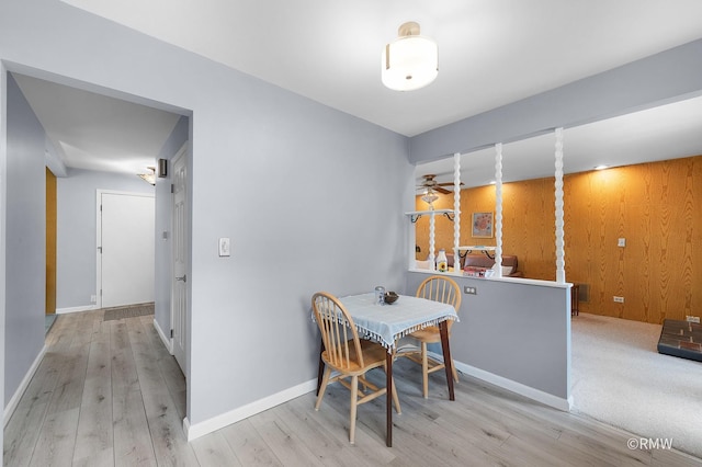 380 Ventura Club Dr, Roselle, IL 60172 - dining area featuring wood finished floors, ceiling fan, and wooden walls