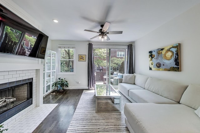 2801 N Wolcott Ave Unit L, Chicago, IL 60657 - living room featuring a fireplace, ceiling fan, wood finished floors, baseboards, and recessed lighting
