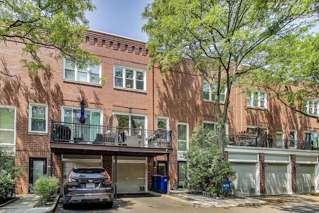 2801 N Wolcott Ave Unit L, Chicago, IL 60657 - rear view of property featuring brick siding and an attached garage