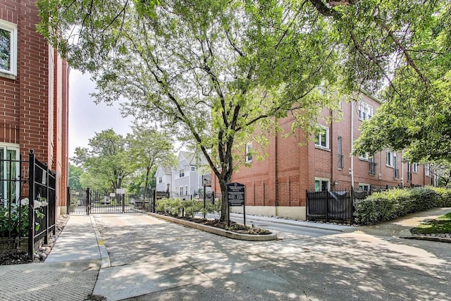 2801 N Wolcott Ave Unit L, Chicago, IL 60657 - view of street featuring a gate, curbs, a residential view, sidewalks, and a gated entry