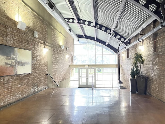 500 S Clinton St Unit 640, Chicago, IL 60607 - lobby featuring brick wall and high vaulted ceiling