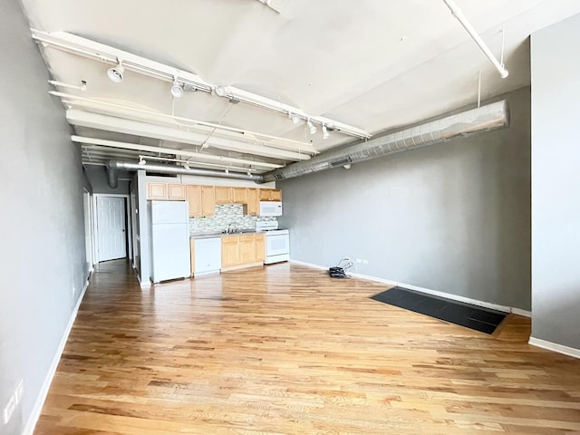500 S Clinton St Unit 640, Chicago, IL 60607 - basement featuring freestanding refrigerator and light wood finished floors