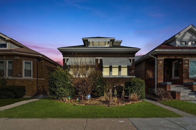 8325 S Dante Ave, Chicago, IL 60619 - view of front facade featuring brick siding and a lawn