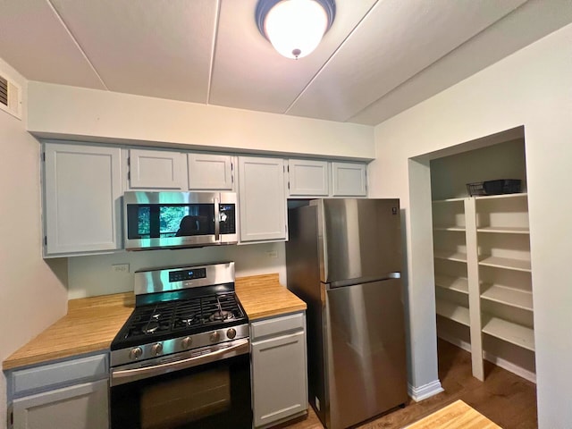 2310 Woodbridge Way Unit 1B, Lombard, IL 60148 - kitchen featuring appliances with stainless steel finishes, light countertops, and gray cabinetry