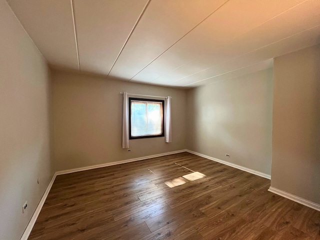 2310 Woodbridge Way Unit 1B, Lombard, IL 60148 - empty room featuring dark wood finished floors and baseboards