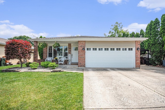 6621 W Victoria Dr, Oak Forest, IL 60452 - ranch-style house featuring a front lawn, driveway, brick siding, a garage, and covered porch