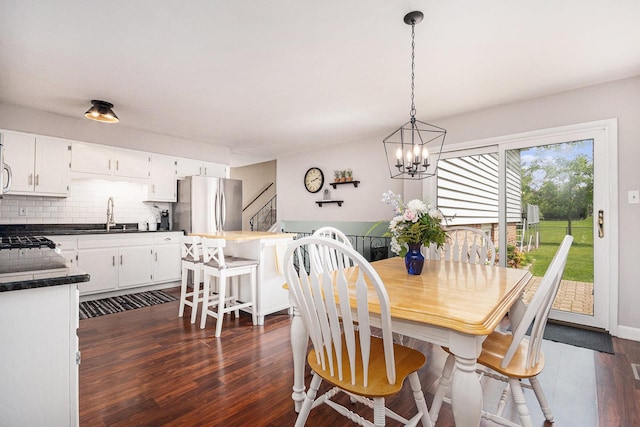 6621 W Victoria Dr, Oak Forest, IL 60452 - dining space with dark wood-style flooring, a chandelier, and stairs