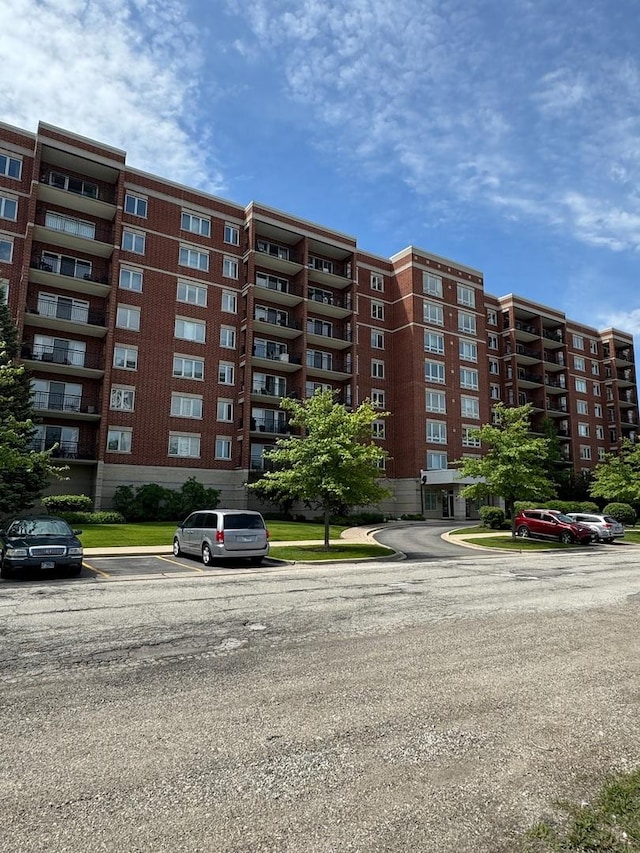5555 N Cumberland Ave Unit 407, Chicago, IL 60656 - view of apartment building / complex with uncovered parking