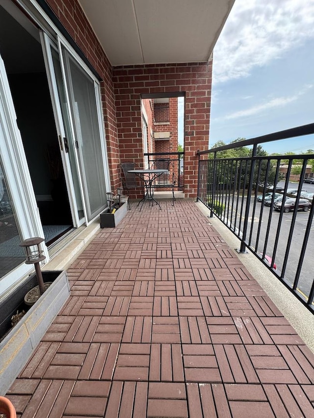 5555 N Cumberland Ave Unit 407, Chicago, IL 60656 - view of patio featuring a balcony