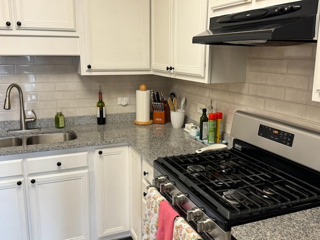 5555 N Cumberland Ave Unit 407, Chicago, IL 60656 - kitchen with gas range, a sink, ventilation hood, white cabinetry, and decorative backsplash
