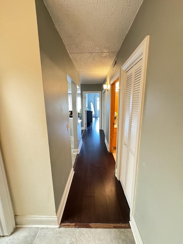 5555 N Cumberland Ave Unit 407, Chicago, IL 60656 - hall with a textured ceiling, baseboards, and hardwood / wood-style floors