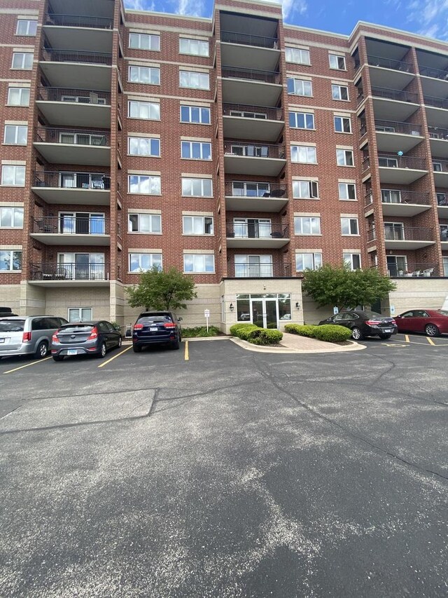 5555 N Cumberland Ave Unit 407, Chicago, IL 60656 - view of apartment building / complex with uncovered parking