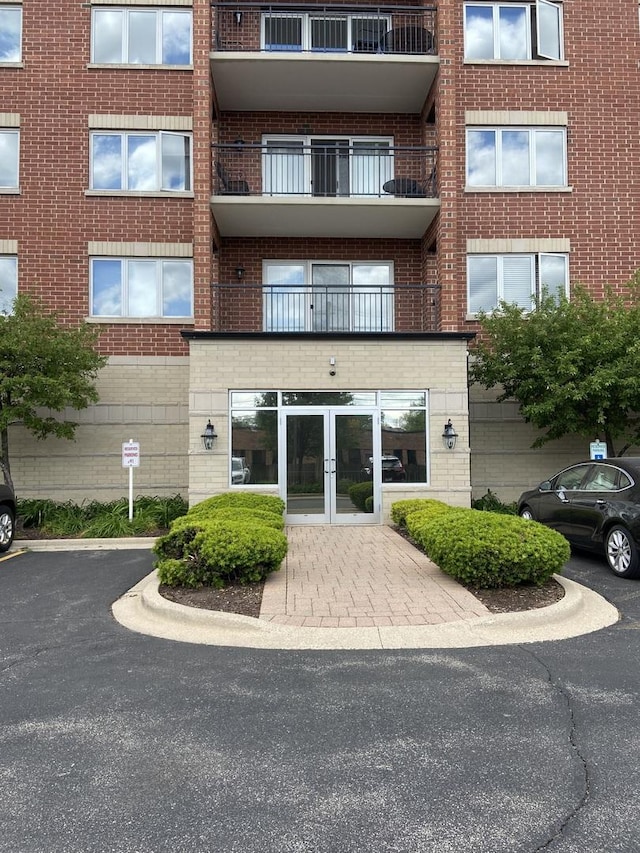 5555 N Cumberland Ave Unit 407, Chicago, IL 60656 - view of apartment building / complex with uncovered parking