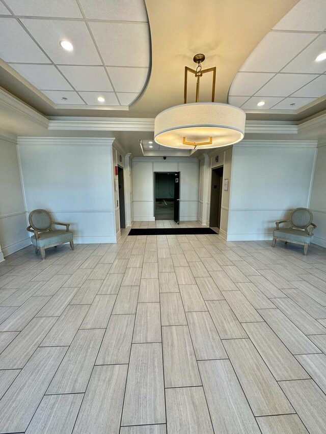 5555 N Cumberland Ave Unit 407, Chicago, IL 60656 - community lobby with crown molding and a decorative wall