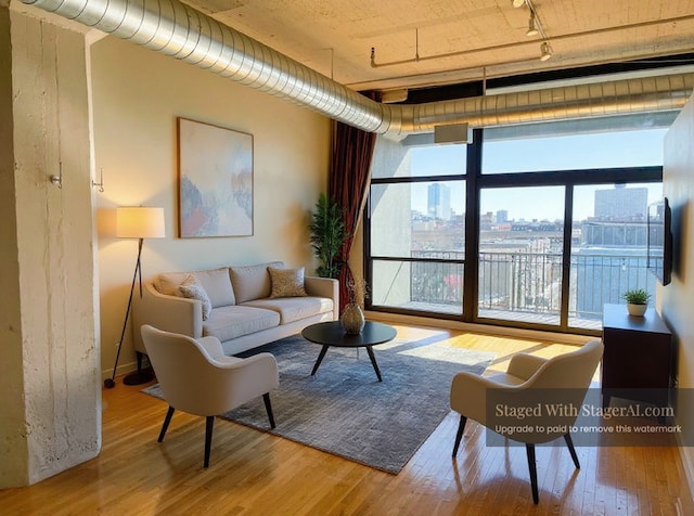 1530 S State St Unit 525, Chicago, IL 60605 - living room with track lighting and wood finished floors