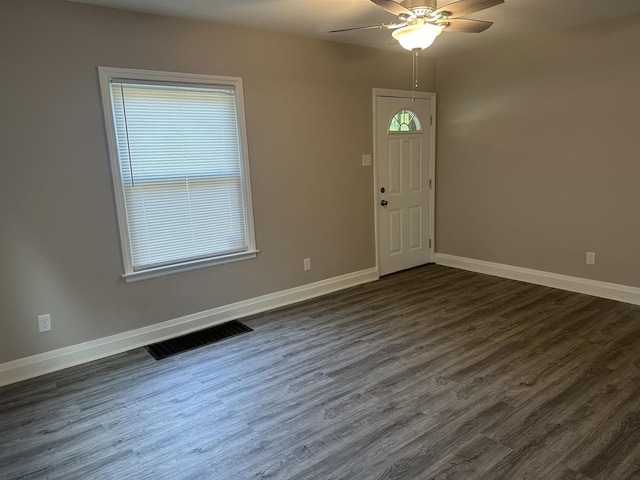 490 Country Club Dr, Kankakee, IL 60901 - foyer entrance with dark wood-style floors, ceiling fan, and baseboards