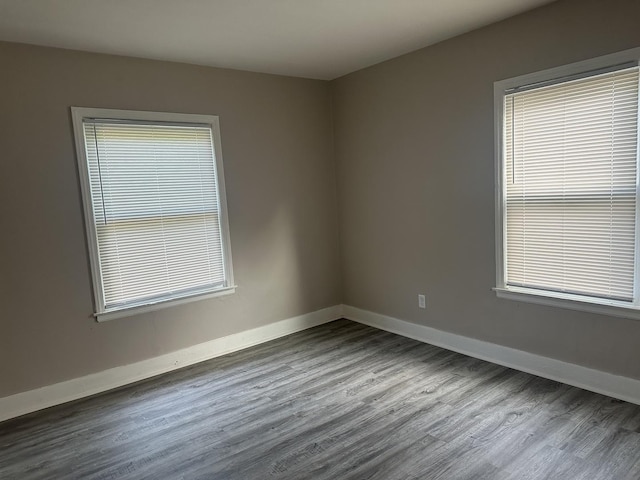 490 Country Club Dr, Kankakee, IL 60901 - spare room featuring wood finished floors, baseboards, and healthy amount of natural light
