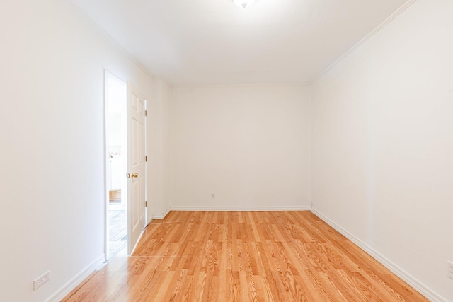 4640 S Winchester Ave, Chicago, IL 60609 - unfurnished room with light wood-style floors, crown molding, and baseboards