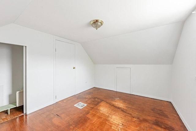 4640 S Winchester Ave, Chicago, IL 60609 - additional living space with vaulted ceiling, hardwood / wood-style flooring, baseboards, and radiator