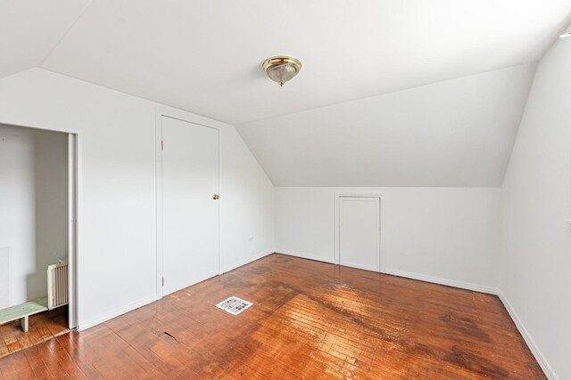 4640 S Winchester Ave, Chicago, IL 60609 - additional living space with vaulted ceiling, hardwood / wood-style flooring, baseboards, and radiator