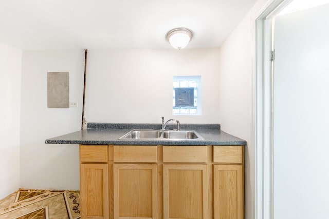 4640 S Winchester Ave, Chicago, IL 60609 - kitchen featuring a sink, light brown cabinets, and dark countertops