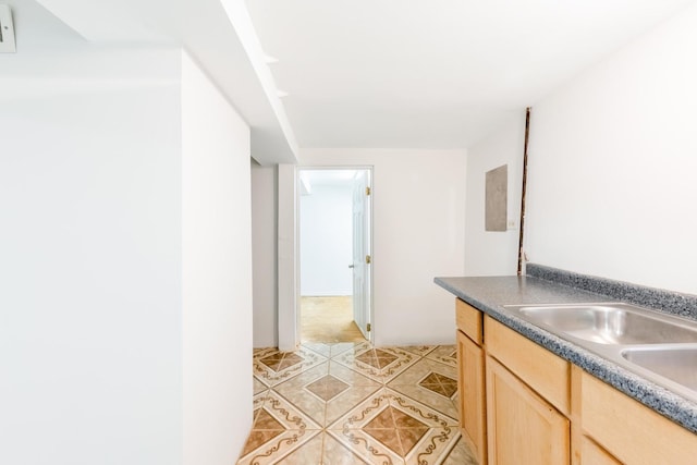 4640 S Winchester Ave, Chicago, IL 60609 - kitchen featuring light brown cabinetry, light tile patterned floors, and a sink