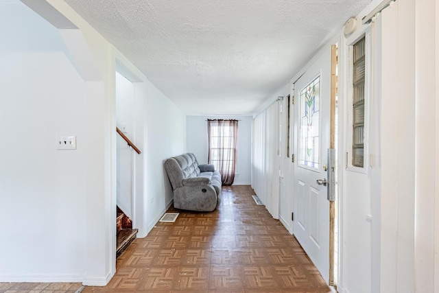 4640 S Winchester Ave, Chicago, IL 60609 - entryway featuring a textured ceiling, stairway, and baseboards