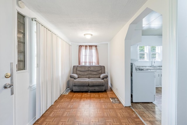 4640 S Winchester Ave, Chicago, IL 60609 - living area featuring a textured ceiling and baseboards