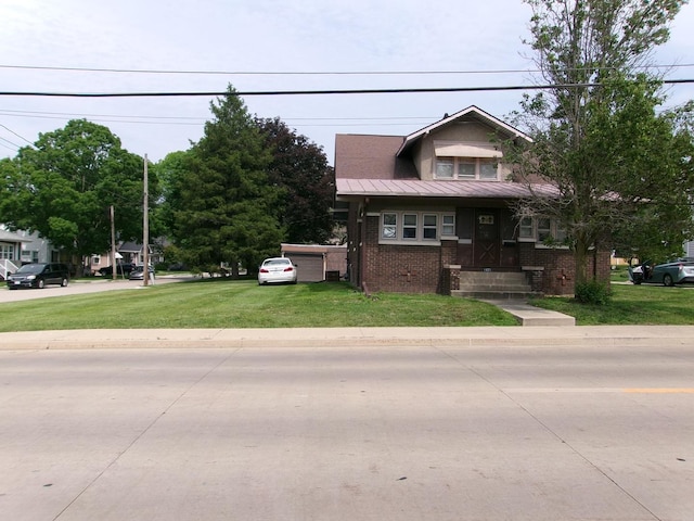 1425 Peoria St, Peru, IL 61354 - view of front of house with a front lawn, brick siding, and metal roof