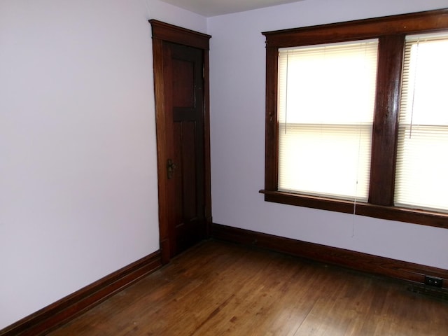 1425 Peoria St, Peru, IL 61354 - unfurnished room featuring plenty of natural light, baseboards, and wood finished floors