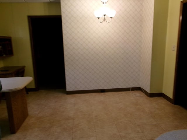 1425 Peoria St, Peru, IL 61354 - unfurnished dining area with baseboards and wallpapered walls