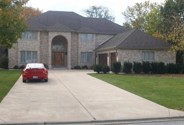 2471 Glen Eagles Dr, Olympia Fields, IL 60461 - view of front of property featuring concrete driveway, a front yard, and an attached garage