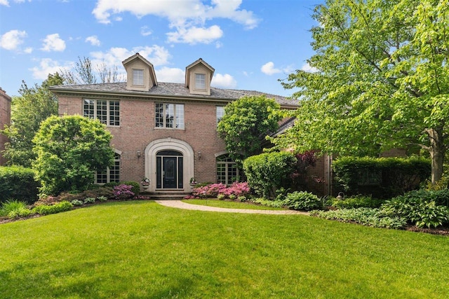 1135 Lawrence Ave, Lake Forest, IL 60045 - colonial-style house with brick siding and a front lawn