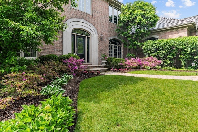 1135 Lawrence Ave, Lake Forest, IL 60045 - doorway to property featuring brick siding and a yard