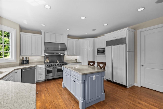 1135 Lawrence Ave, Lake Forest, IL 60045 - kitchen featuring built in appliances, under cabinet range hood, white cabinetry, dark wood-style flooring, and recessed lighting