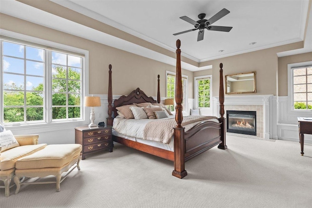 1135 Lawrence Ave, Lake Forest, IL 60045 - bedroom with carpet flooring, a tile fireplace, wainscoting, and crown molding