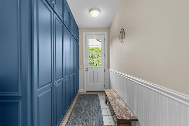 1135 Lawrence Ave, Lake Forest, IL 60045 - doorway to outside featuring light tile patterned flooring and a wainscoted wall