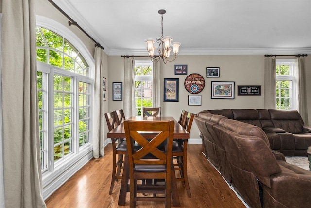 1135 Lawrence Ave, Lake Forest, IL 60045 - dining area featuring a chandelier, crown molding, and wood finished floors