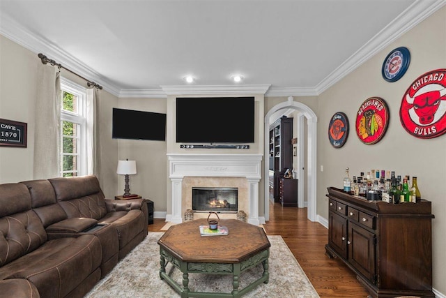 1135 Lawrence Ave, Lake Forest, IL 60045 - living room featuring crown molding, a glass covered fireplace, dark wood-style flooring, and arched walkways