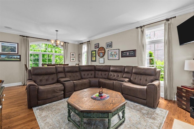 1135 Lawrence Ave, Lake Forest, IL 60045 - living room with a chandelier, healthy amount of natural light, crown molding, and wood finished floors