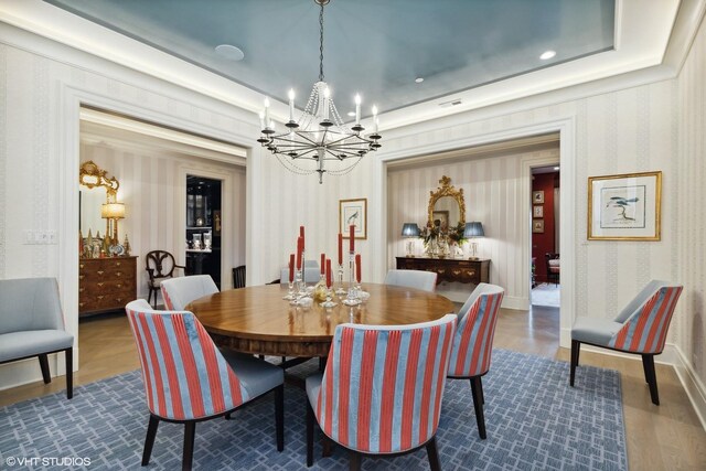727 N Mckinley Rd Unit 100, Lake Forest, IL 60045 - dining area with a chandelier, wallpapered walls, and dark wood-type flooring