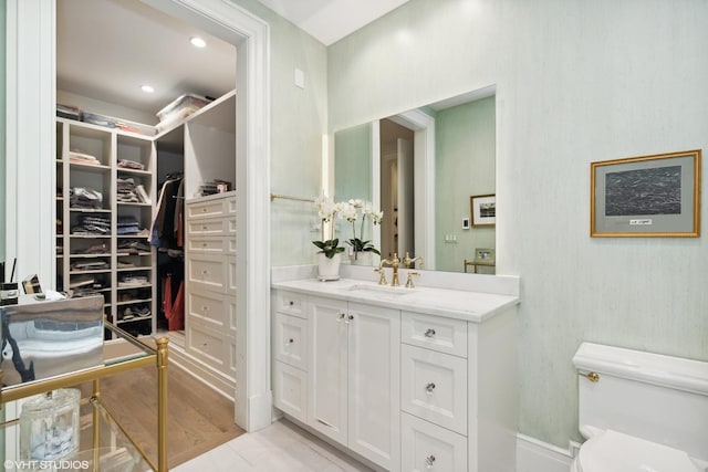 727 N Mckinley Rd Unit 100, Lake Forest, IL 60045 - bathroom with vanity, toilet, and a walk in closet