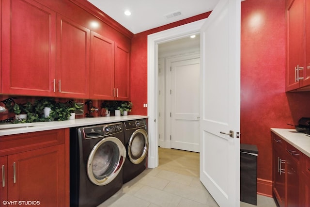 727 N Mckinley Rd Unit 100, Lake Forest, IL 60045 - laundry room featuring cabinet space, washer and clothes dryer, recessed lighting, and light tile patterned floors