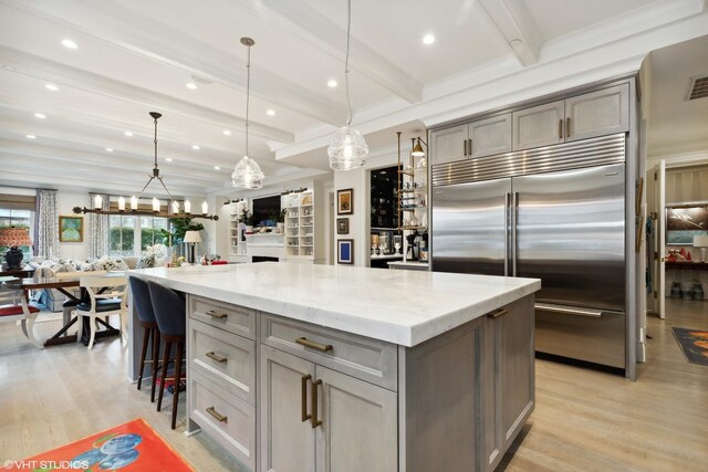 727 N Mckinley Rd Unit 100, Lake Forest, IL 60045 - kitchen with built in fridge, gray cabinetry, light wood-style floors, a kitchen island, and beam ceiling