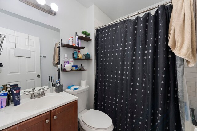1630 N Avers Ave, Chicago, IL 60647 - bathroom with vanity, toilet, and a shower with shower curtain
