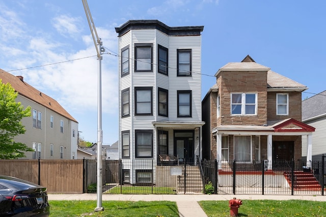 1630 N Avers Ave, Chicago, IL 60647 - townhome / multi-family property with a fenced front yard