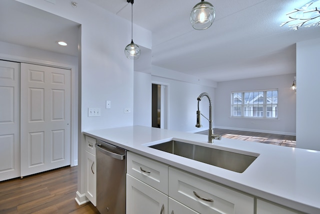 210 N Addison Ave Unit 201, Elmhurst, IL 60126 - kitchen featuring stainless steel dishwasher, a sink, light countertops, dark wood-style floors, and white cabinets