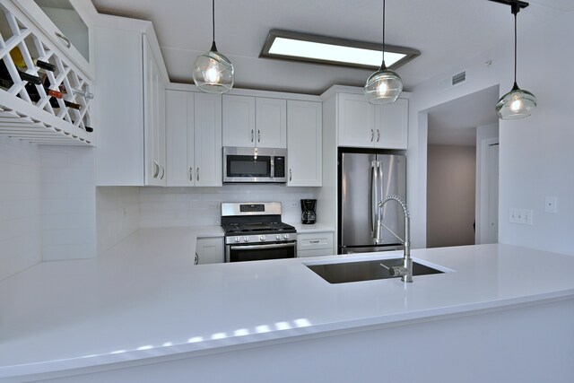 210 N Addison Ave Unit 201, Elmhurst, IL 60126 - kitchen with appliances with stainless steel finishes, a sink, white cabinetry, and tasteful backsplash