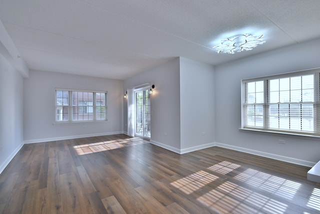 210 N Addison Ave Unit 201, Elmhurst, IL 60126 - spare room featuring dark wood finished floors and baseboards