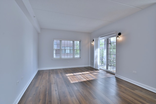 210 N Addison Ave Unit 201, Elmhurst, IL 60126 - spare room featuring dark wood-style flooring and baseboards